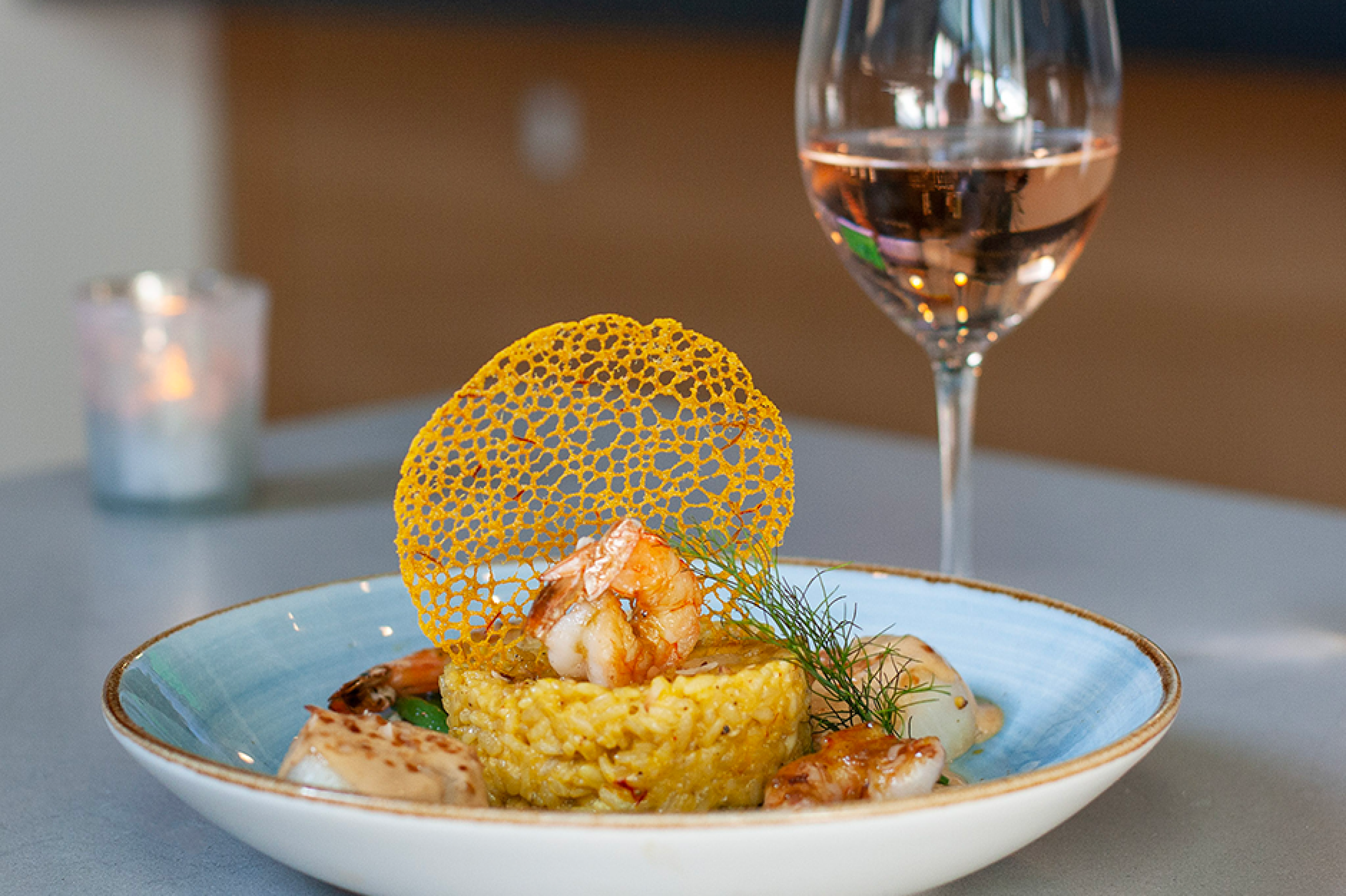 seafood dish with a glass of rose