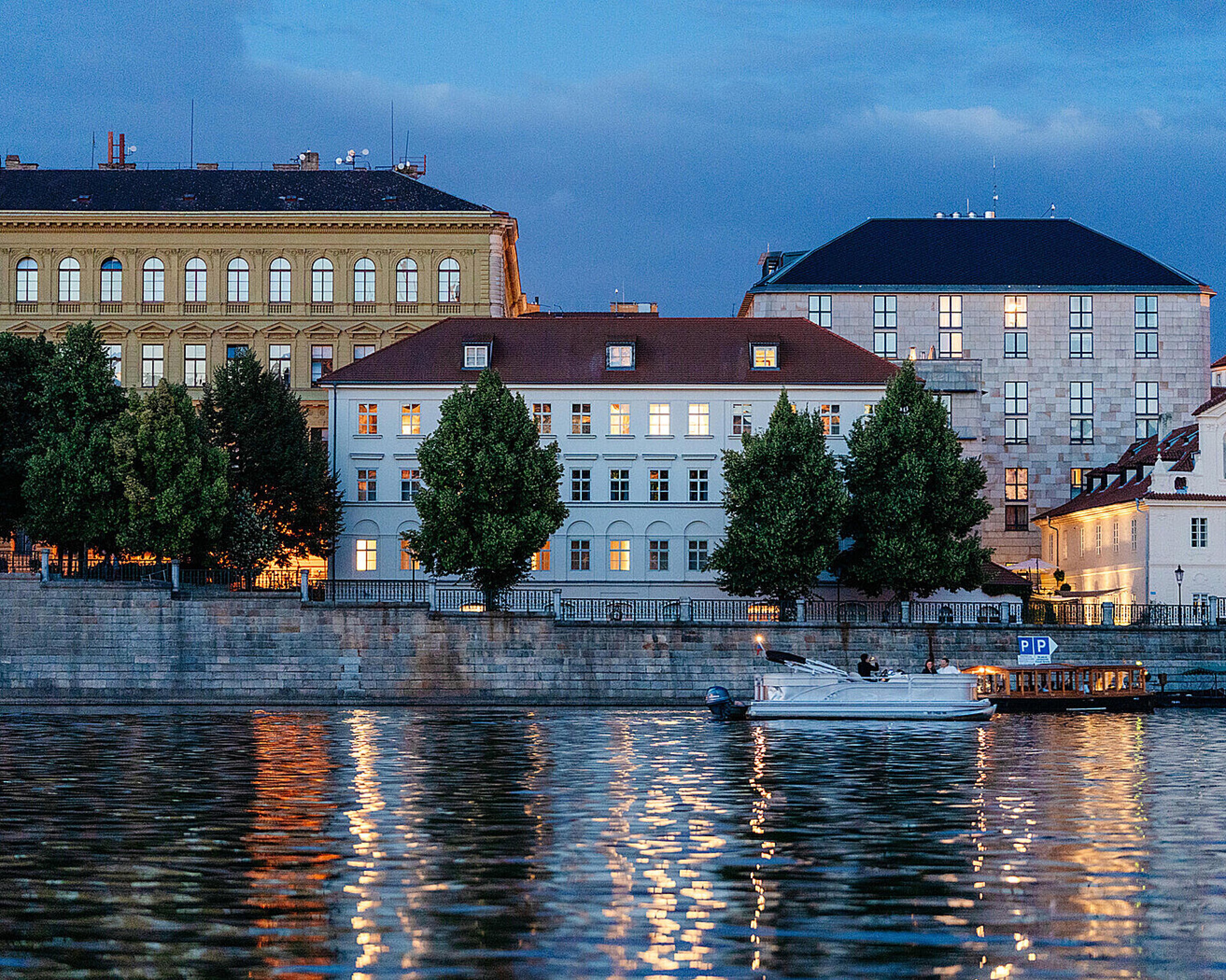 large buildings next to a river