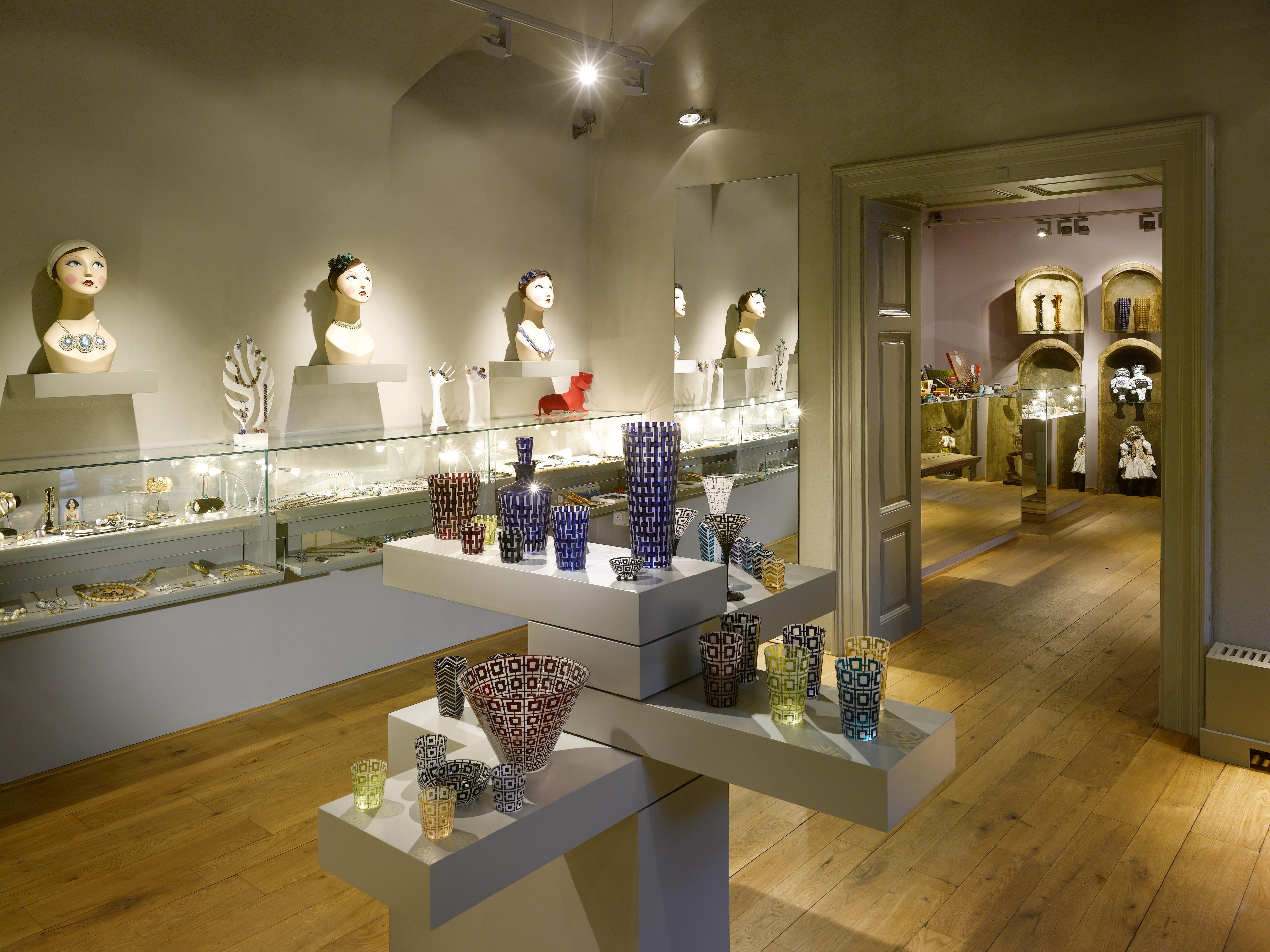 glassware on shelves displayed in a boutique