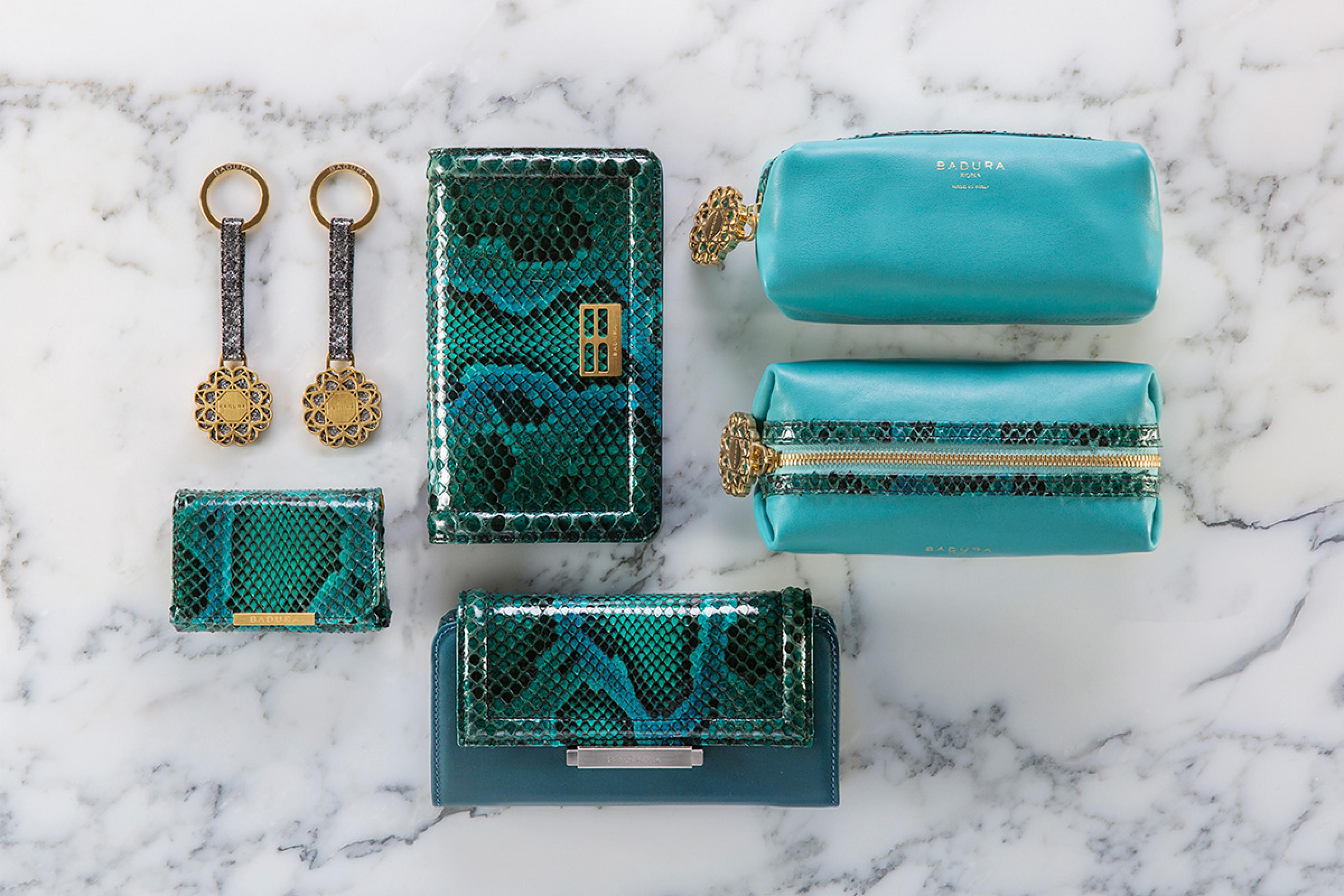 an overhead view of teal leather bags and clutches