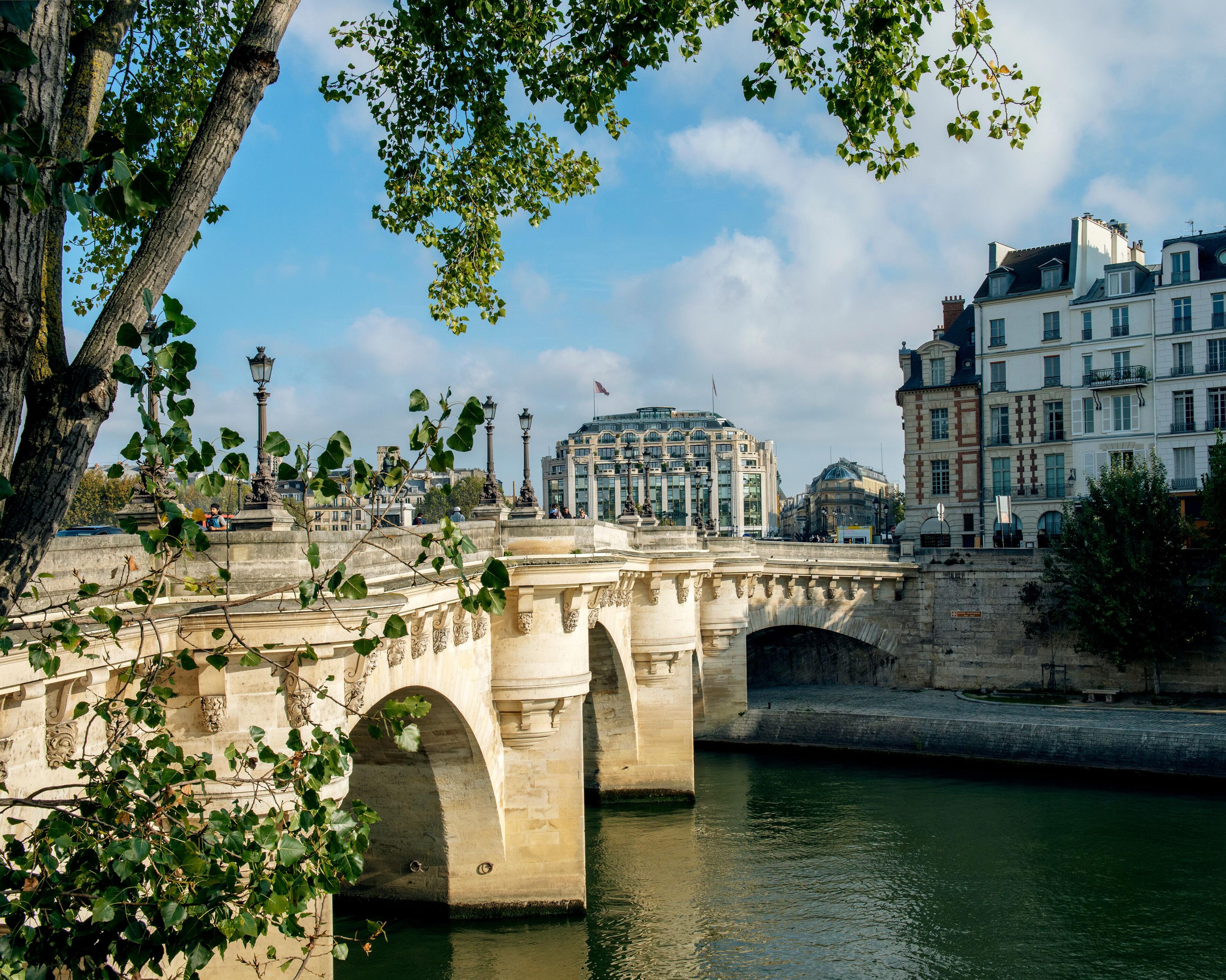 The hotel in the distance past a bridge 